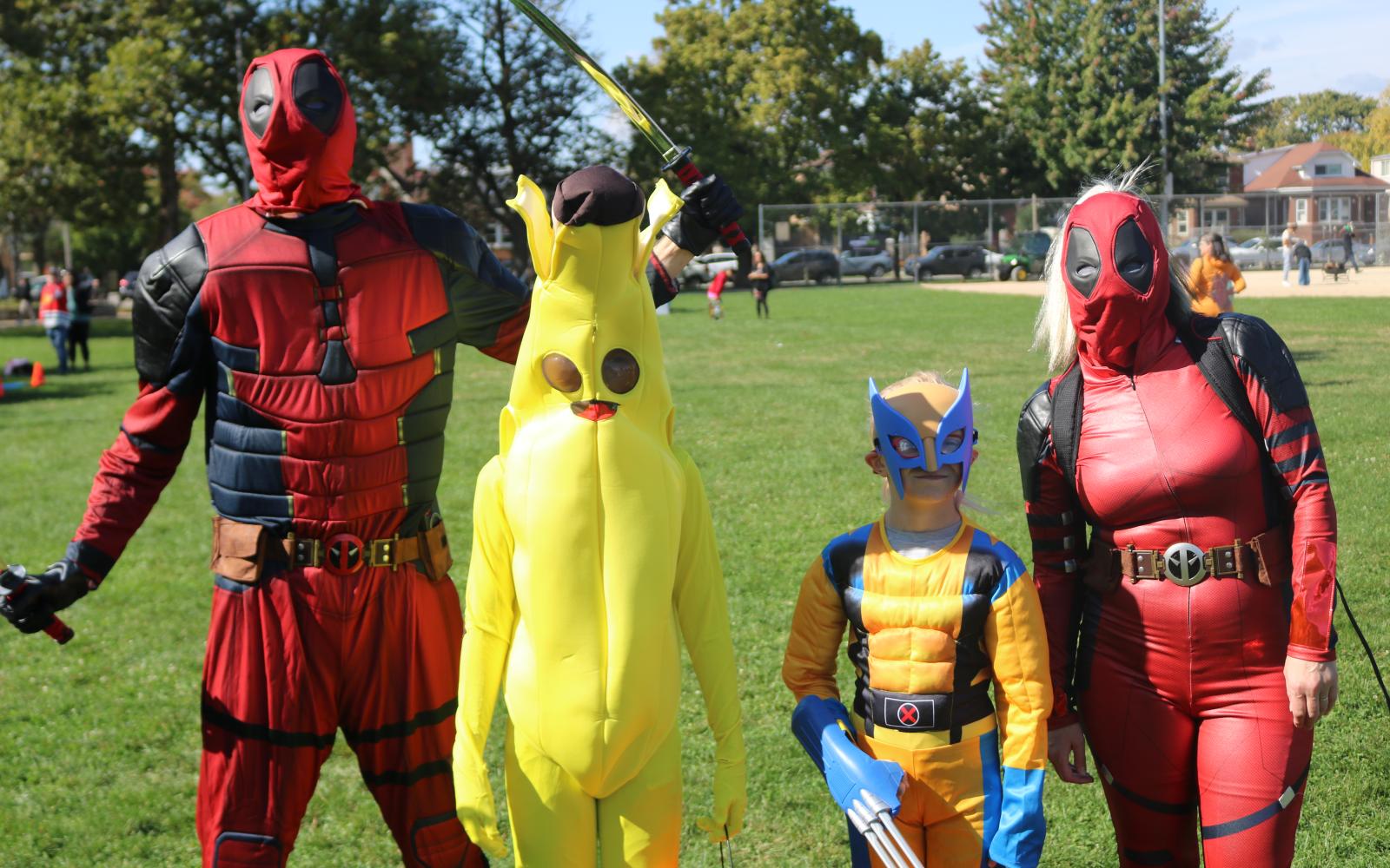 an image of a family dressed in Halloween costumes