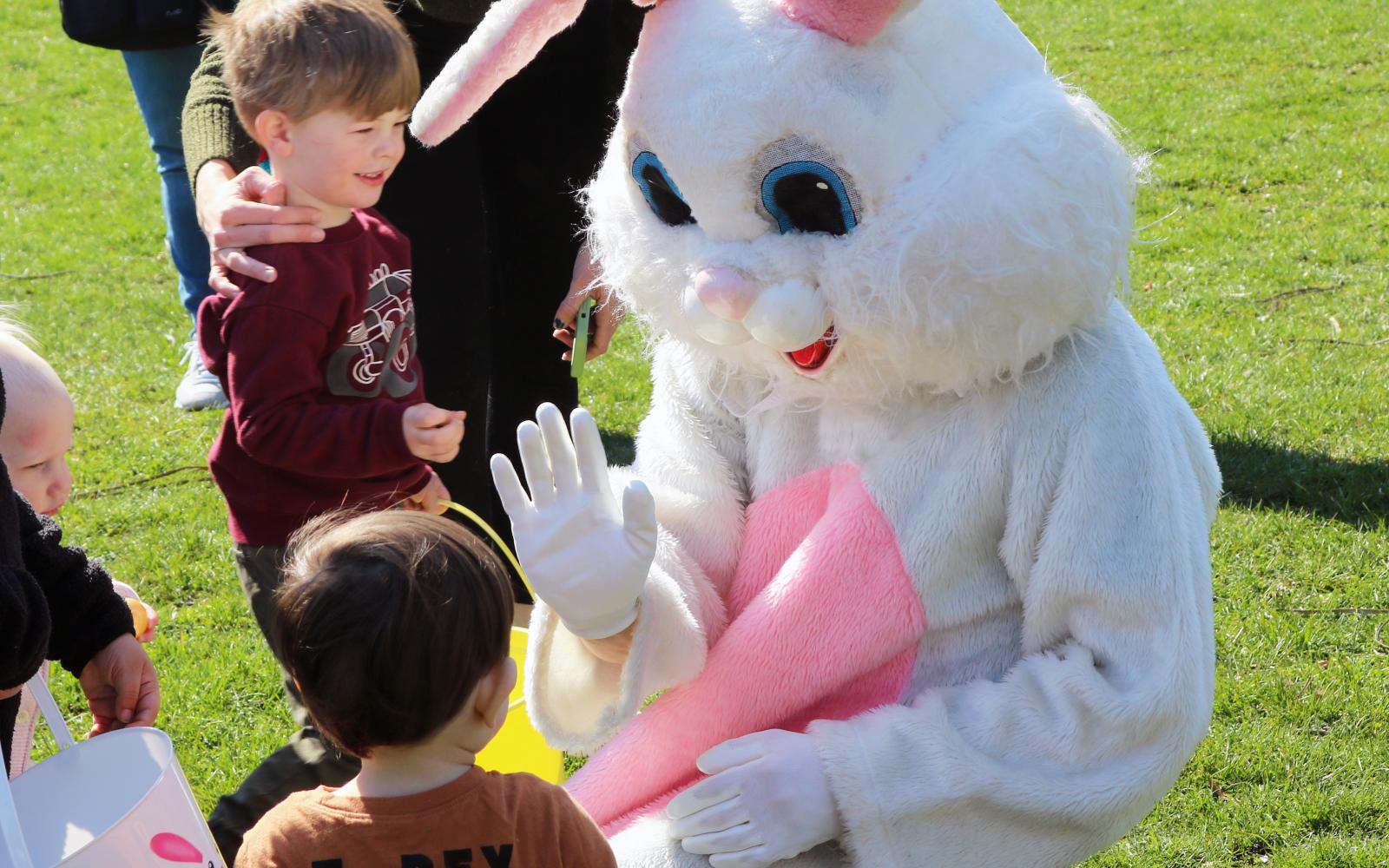 photo of an Easter Bunny interacting with Children