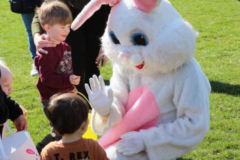 photo of an Easter Bunny interacting with Children