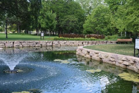 an image of the Proksa Park West Pond with the fountain running