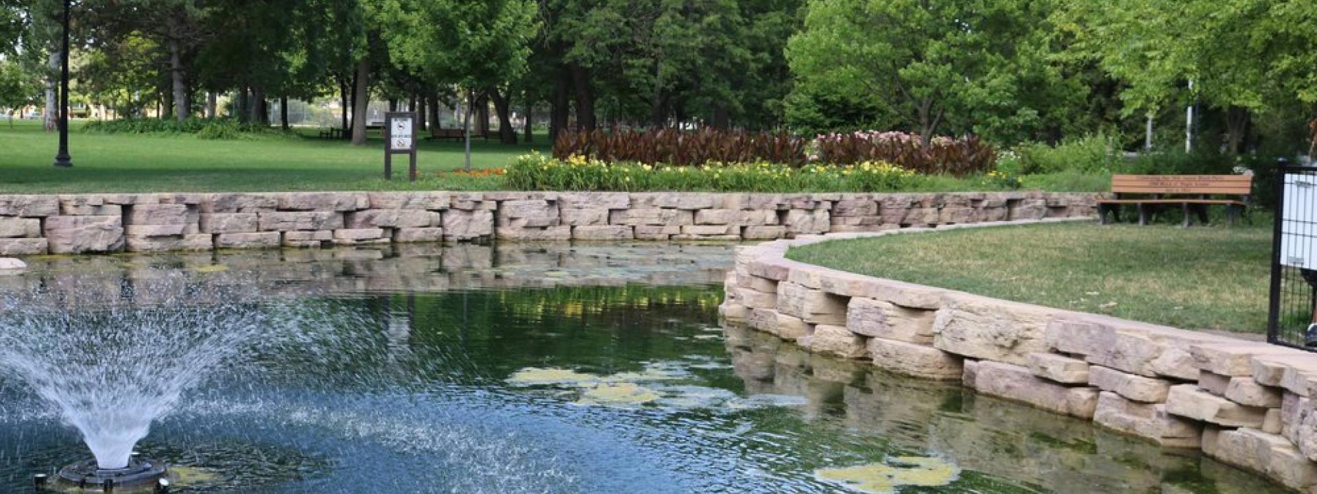 An image of the West pond at Proksa Park with the fountain running.